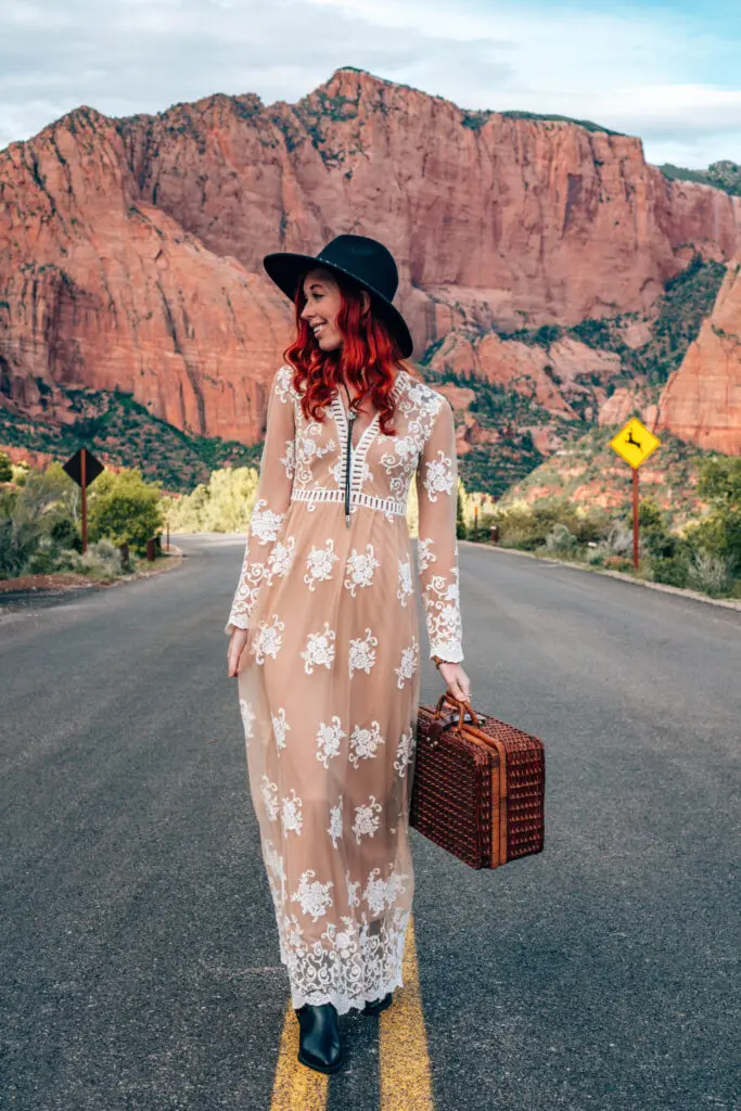 Portraits of woman with Red rock cliffs behind. Kolob Canyon