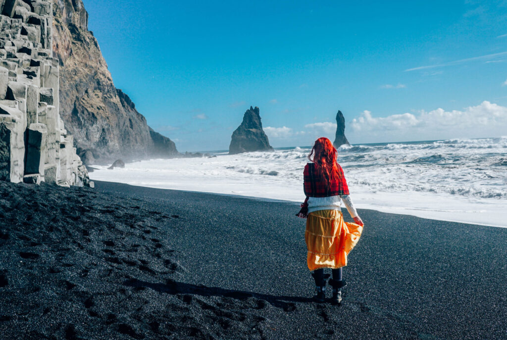 Standing on black sand beach