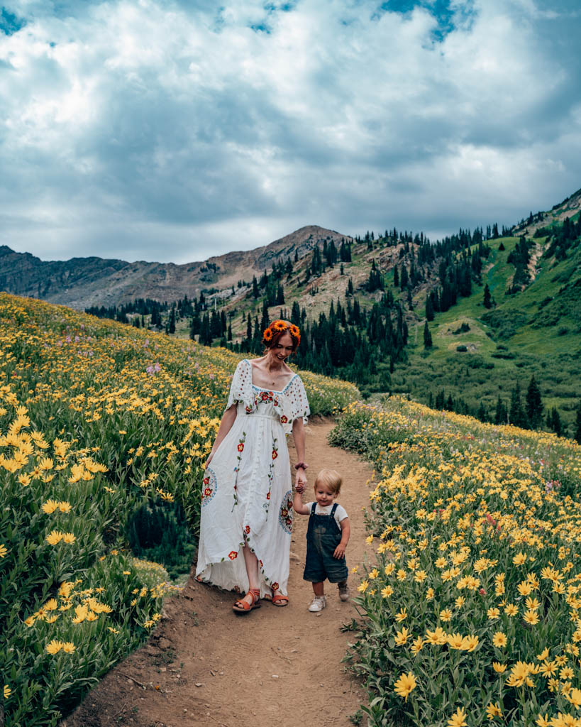 Walking on path surrounded by wildflowers