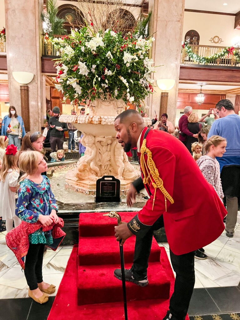 Man talking to kids about the ducks running