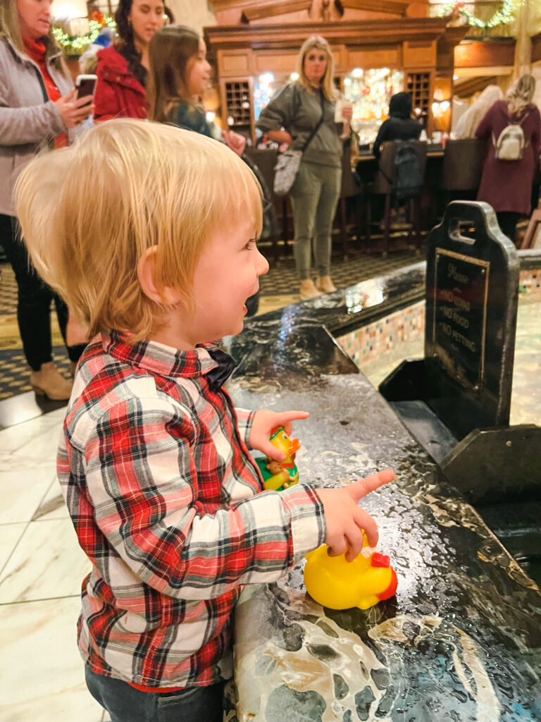 Hughie holding a rubber duck at the Peabody hotel