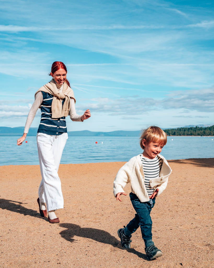 Aubrie and Hughie running on Lake Tahoe Beach