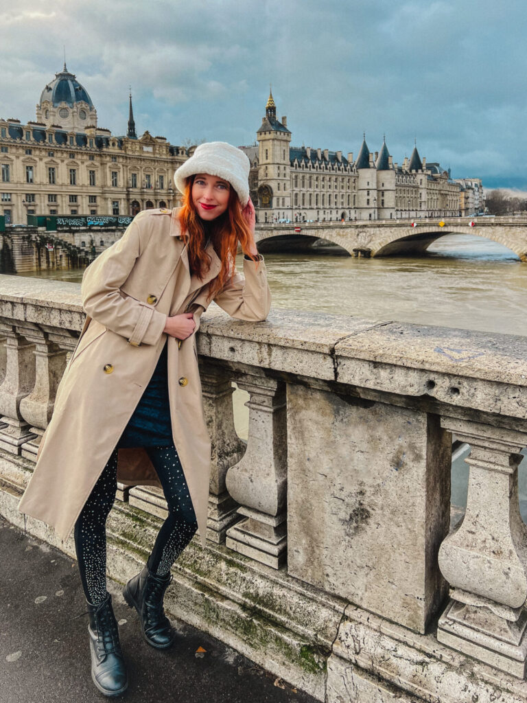 Lace black dress and trench coat in Paris 