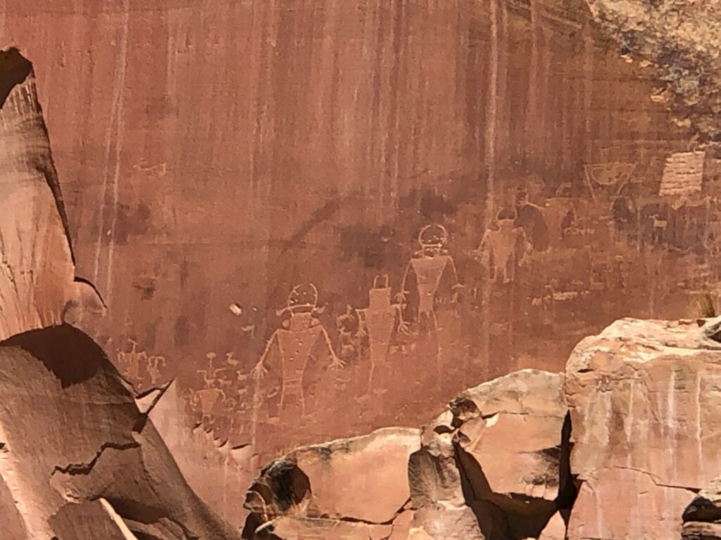 Multiple Petroglyphs carved in red rock