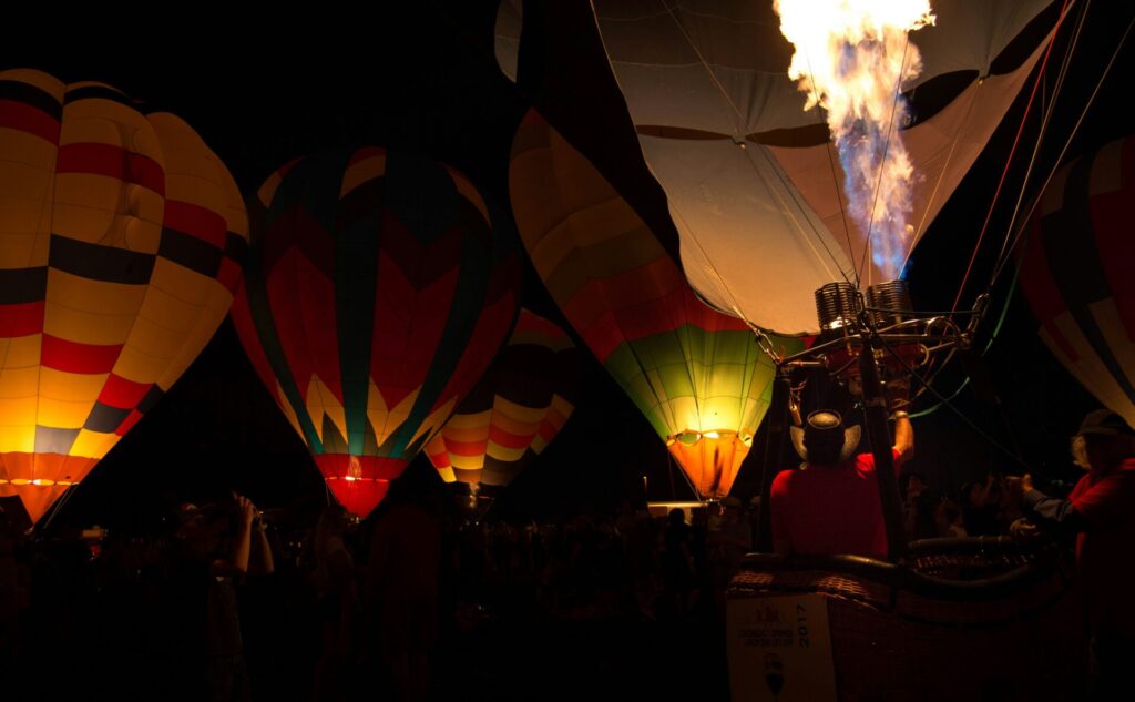Hot air balloons lighting up during the night in Kanab utah