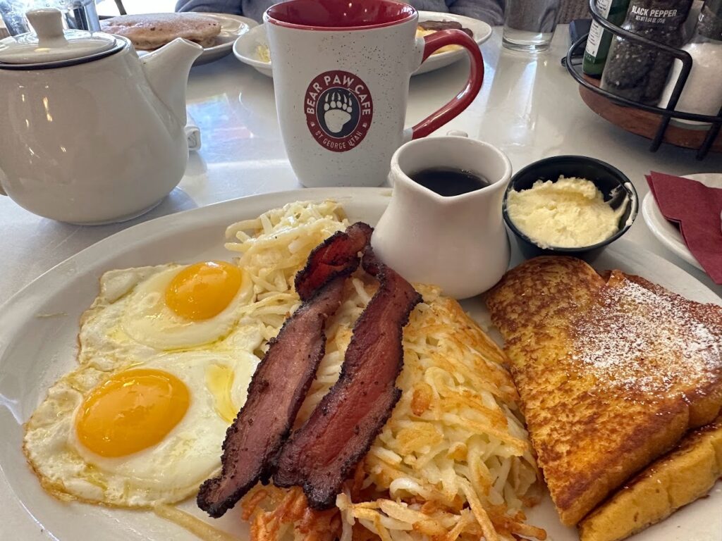 Plate of bacon eggs and hashbrowns from Bear Paw Cafe